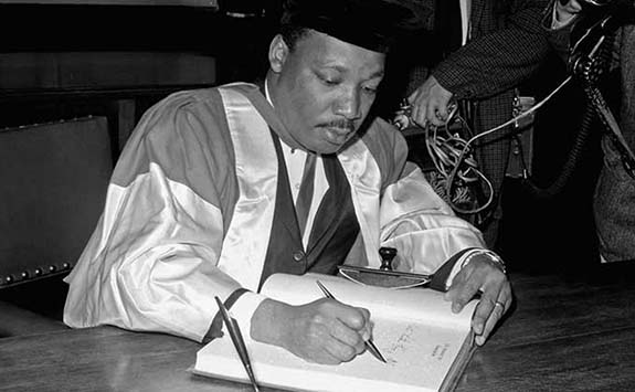 Martin Luther King signing for his Honorary degree